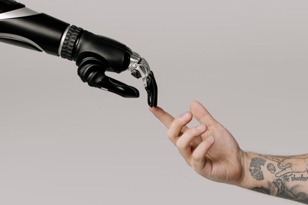 robot hand touching human hand